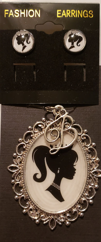 Barbie necklace set featuring black and white silhouette earrings and ornate pendant necklace