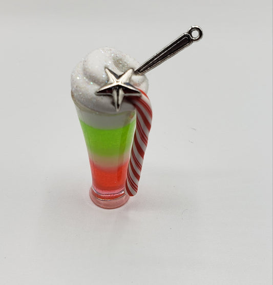 Chef Gina's Grinch themed Christmas candy drink with layered red and green colors and whipped cream topping