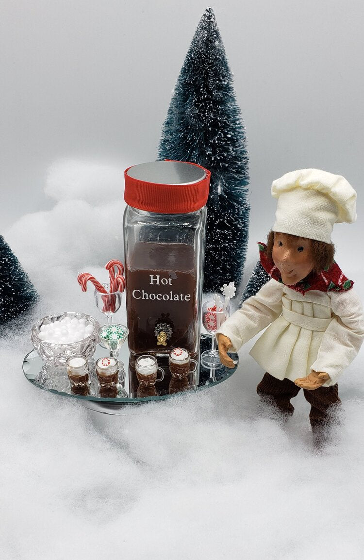 Chefginas mini hot chocolate bar for dolls with decorative jars and candy canes on a festive display