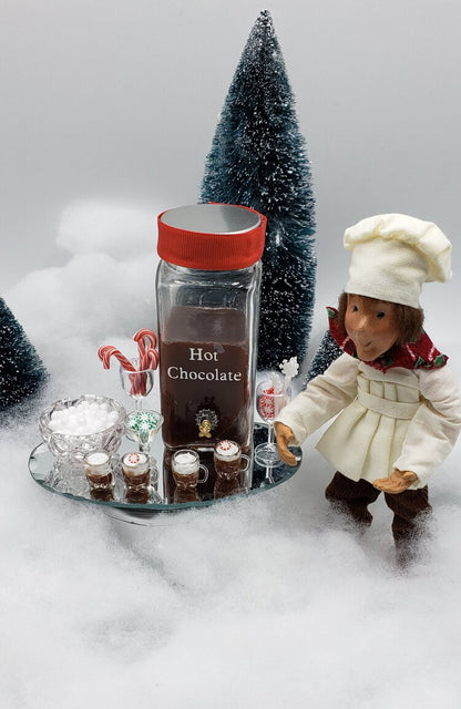 Chefginas mini hot chocolate bar for dolls with decorative jars and candy canes on a festive display