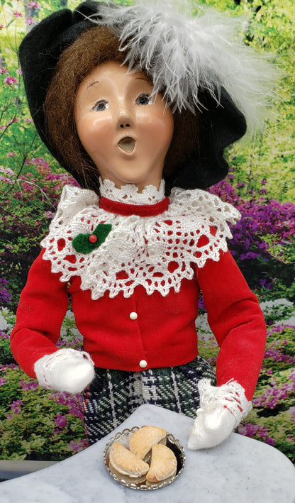 Chef Gina’s miniature pierogi for dolls displayed on a tray with a doll in traditional attire