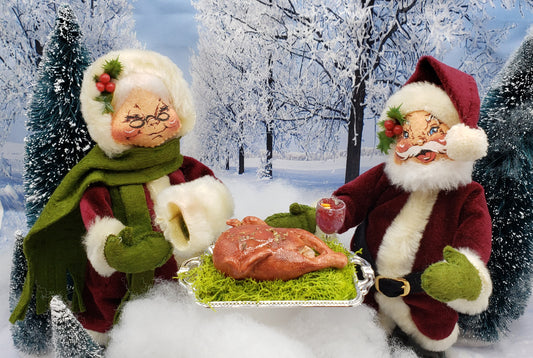 Miniature turkey platter for dolls with holiday-themed Santa and Mrs Claus figures in snowy winter scene